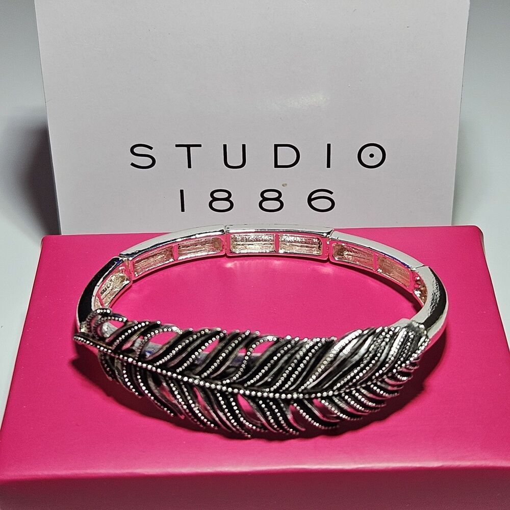Avon Silver Tone Flowing Feather Stretch Bracelet